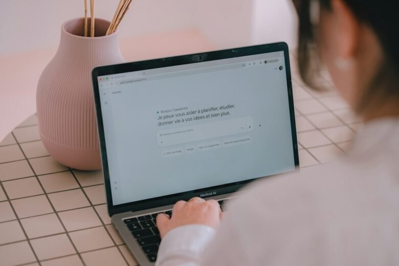 AI assistant interface being used on a laptop. Photo by Swello on Unsplash.