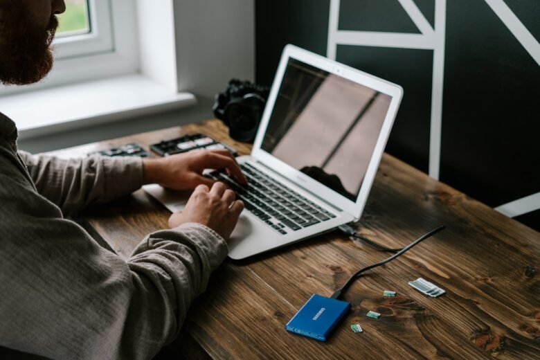 Person using a laptop illustrating backup restore verification
