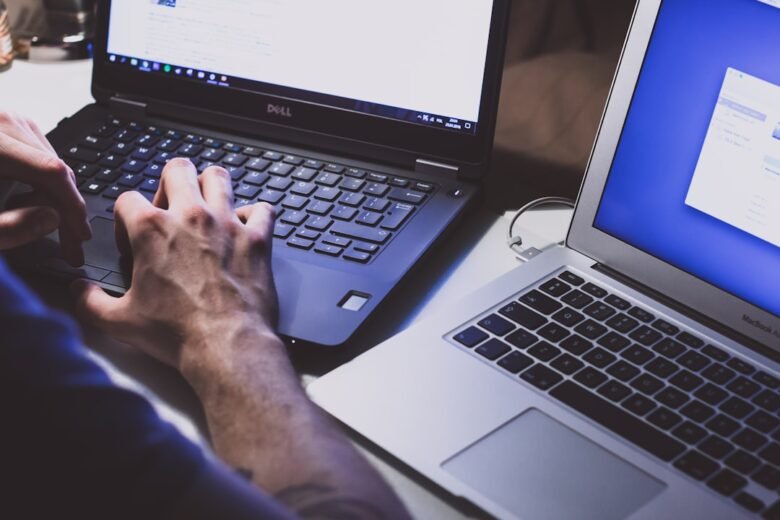 Person using a laptop for browser extension safety guide. Photo by freestocks on Unsplash.