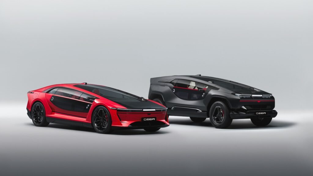 Red Ceer EXOBOT electric sedan beside a dark gray EXOBOT electric SUV in a studio