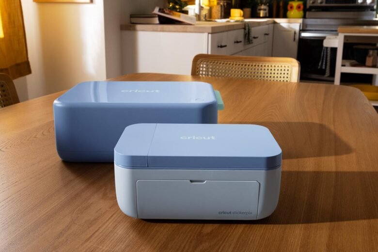 Cricut StickerPix Print + Cut and StickerPix Print machines with sample sticker sheets and photo prints