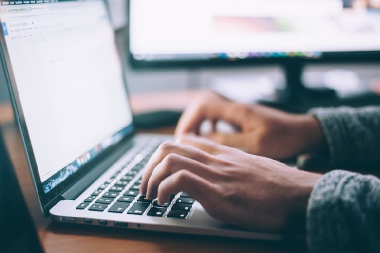 Person using a laptop illustrating hands-on technology review methodology