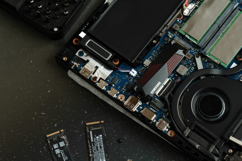 Open laptop showing internal SSD storage components