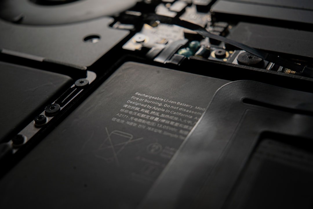 Opened laptop showing its internal lithium-ion battery