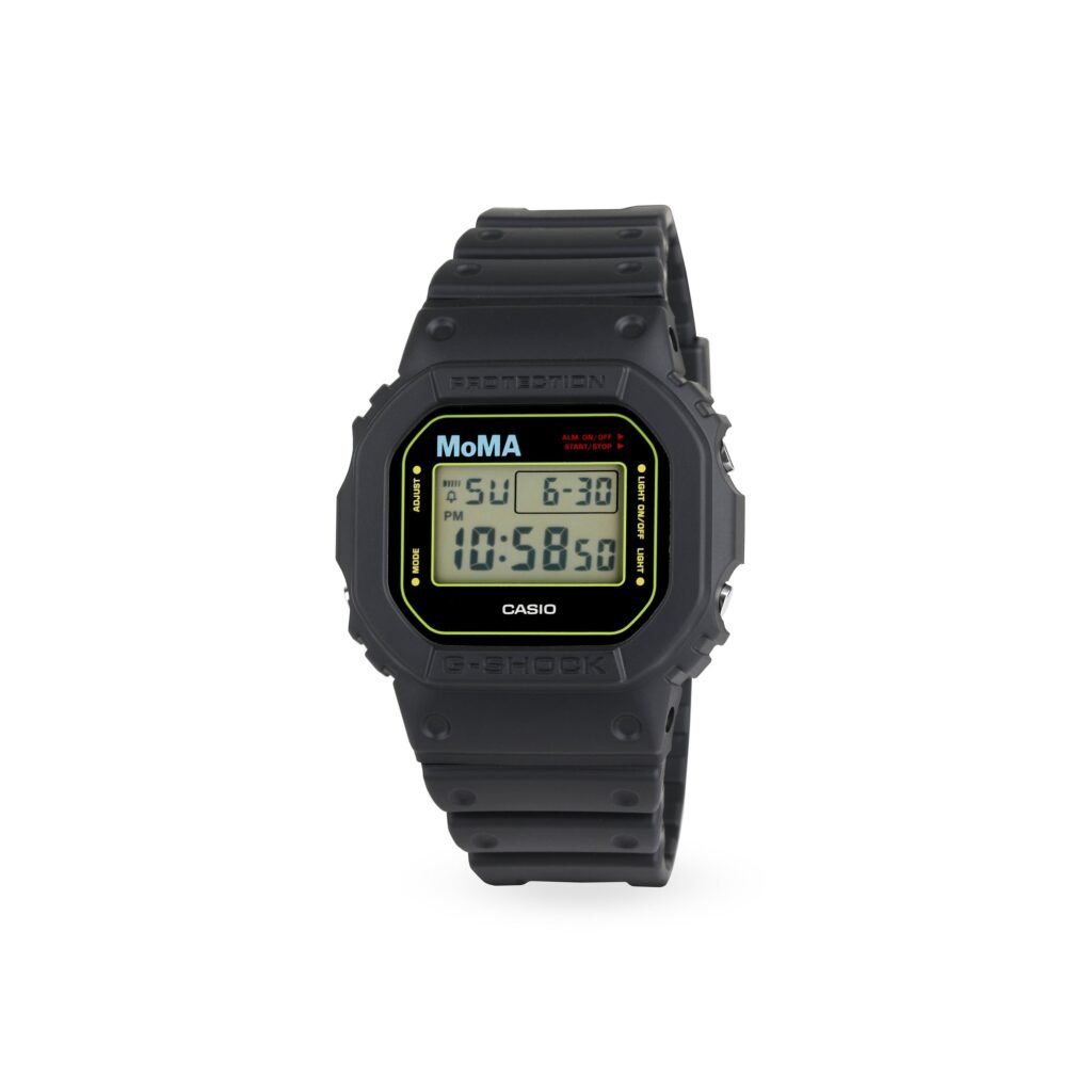 Black MoMA Casio G-Shock with a digital display, cyan MoMA logo and chartreuse face border