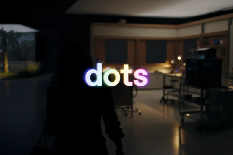 OpenAI dots logo glowing over a dimly lit workspace