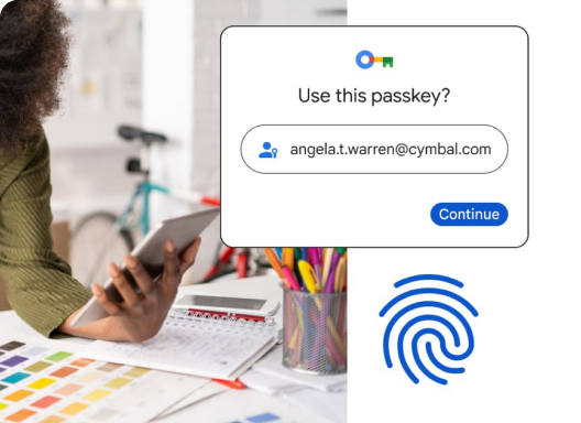 Google illustration of a sample passkey account chooser beside a person holding a phone