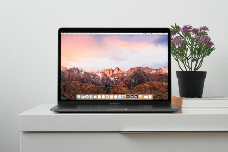 MacBook representing Safari 27 and MCP support for AI coding agents
