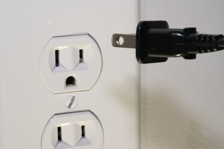 Electrical plug and outlet representing smart plug appliance compatibility checks
