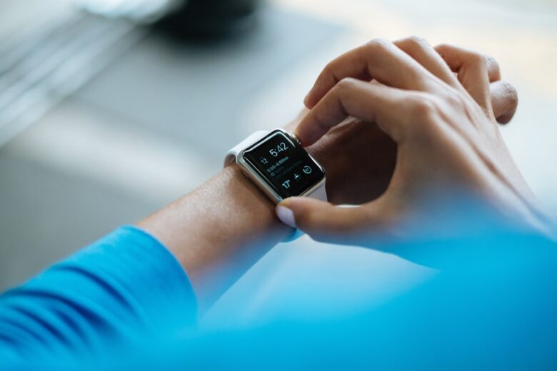 Smartwatch paired with a phone representing smartwatch and smartphone compatibility