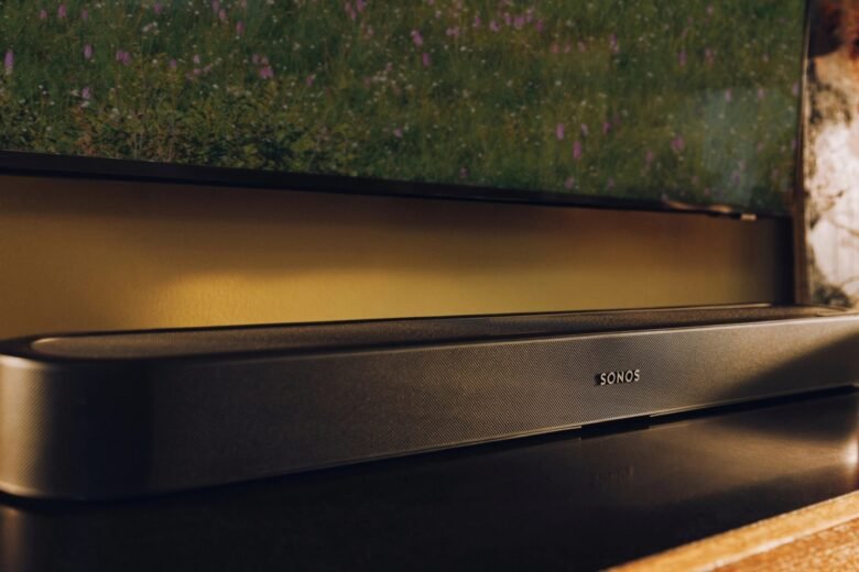 Black Sonos Beam Ultra soundbar positioned beneath a television; image: Sonos