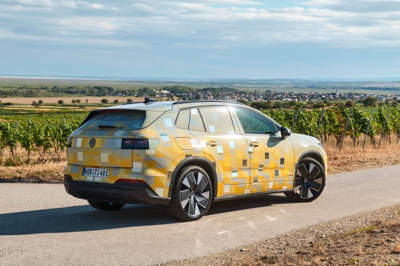 Camouflaged near-production Volkswagen ID. Tiguan electric SUV on a country road