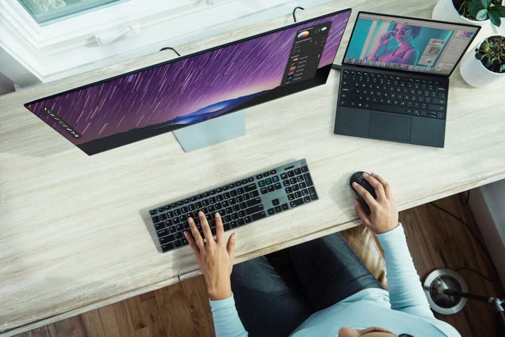 Computer workstation with laptop and monitor