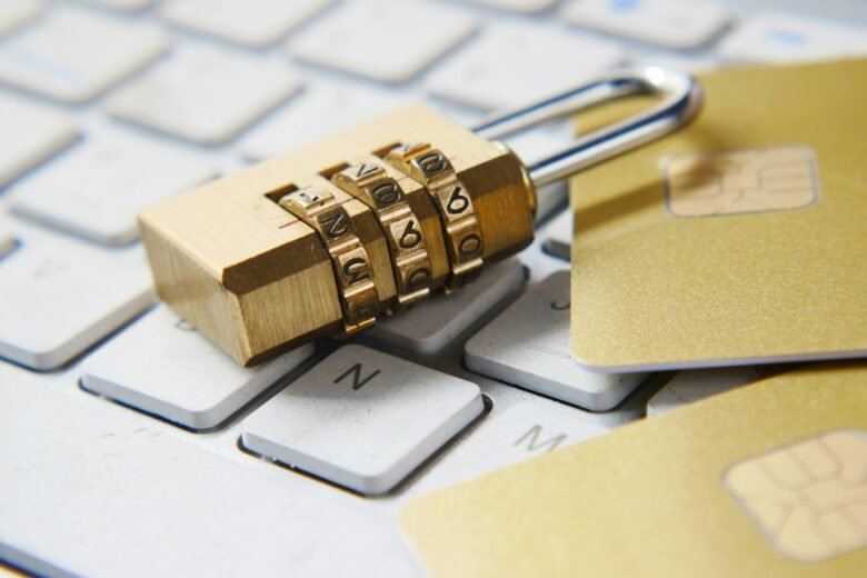 A gold padlock resting on a computer keyboard, illustrating protection of digital court records. Photo by Towfiqu barbhuiya on Unsplash.