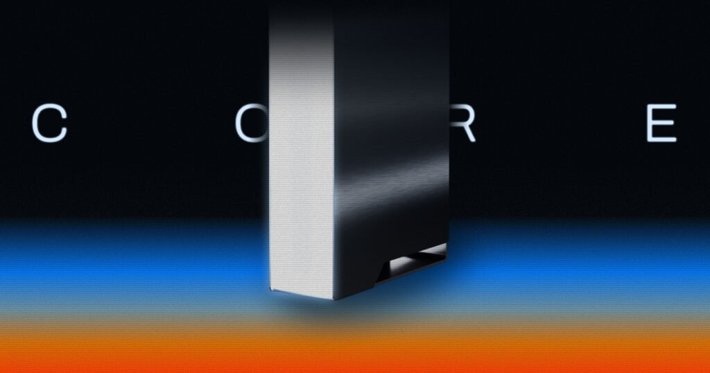 Ghost Core personal AI computer, a compact black and silver tower, shown against a dark background with blue and orange light. Image: Ghost.