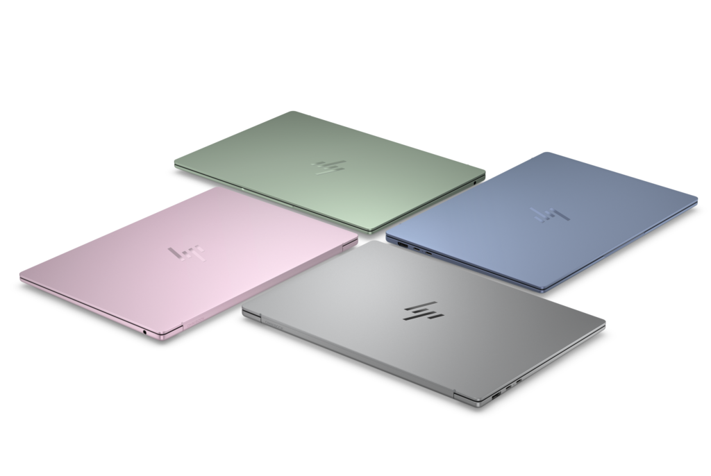 Four HP OmniBook 5 14 laptops in blue, green, pink and silver, shown from above. Image: HP.