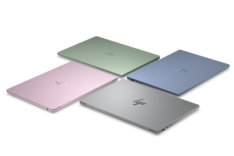 Four HP OmniBook 5 14 laptops in blue, green, pink and silver, shown from above. Image: HP.