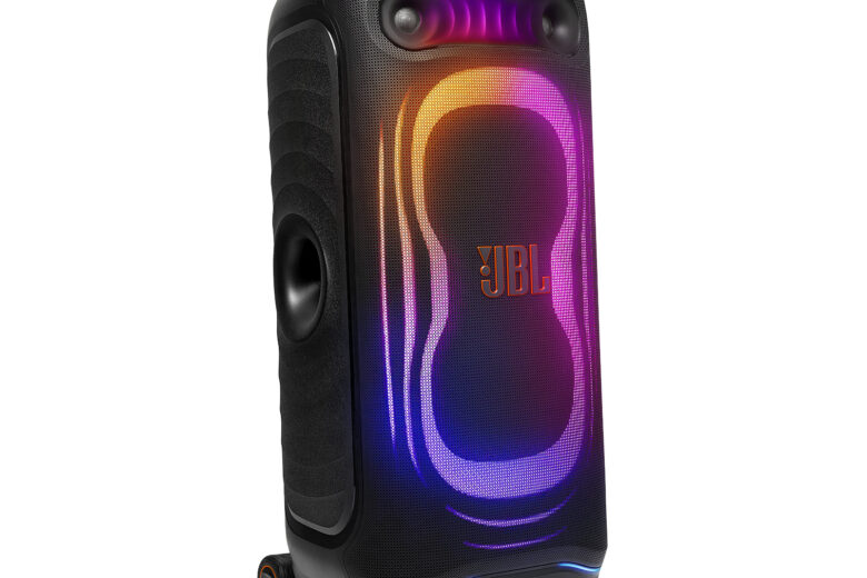 JBL PartyBox Ultimate 2 party speaker with its illuminated front light panel, dual woofers and transport wheels visible. Image: JBL.