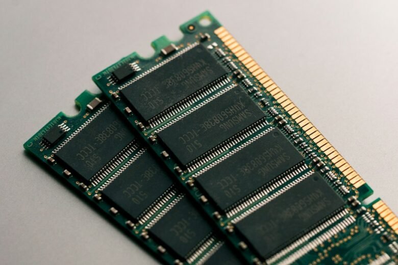 Two Samsung RAM memory modules with black chips and gold contacts. Photo: Harrison Broadbent via Unsplash.