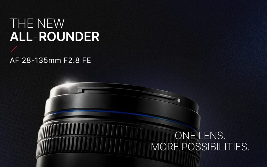 Close-up teaser of the Samyang AF 28-135mm F2.8 FE lens against a black background