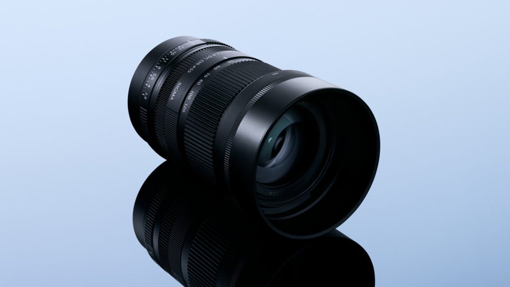 Sigma 50-120mm F2.8 DC OS Contemporary APS-C telephoto zoom lens on a blue studio background