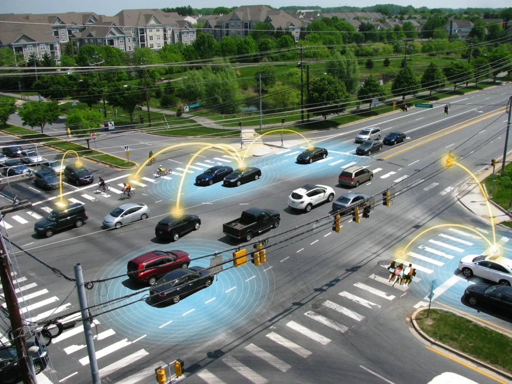 Connected intersection showing cars, pedestrians, cyclists and digital sensor overlays