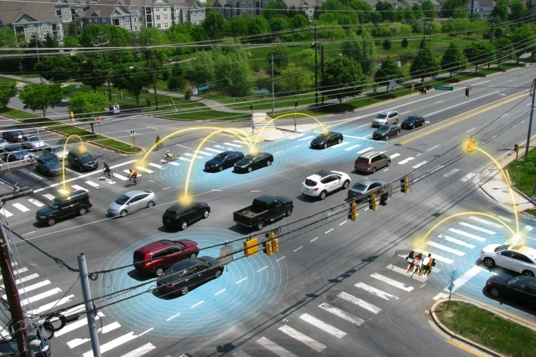 Connected intersection showing cars, pedestrians, cyclists and digital sensor overlays