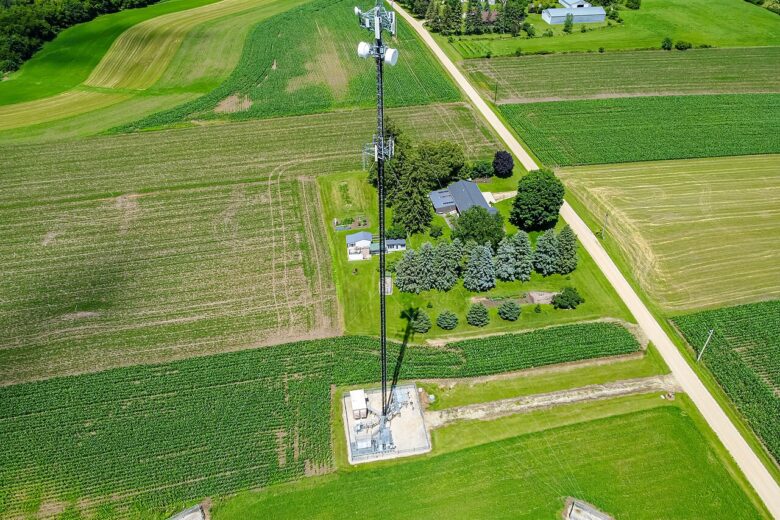 Cellular tower under an open sky, representing terrestrial infrastructure for satellite-to-phone service