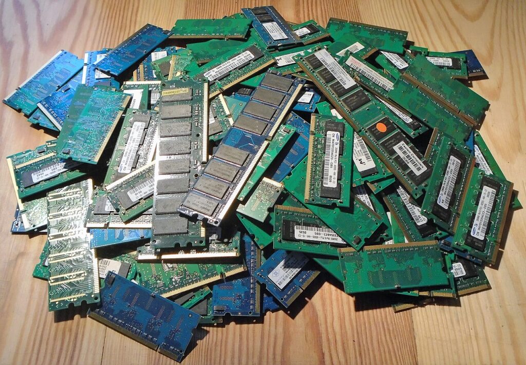 A pile of desktop and laptop RAM memory modules, illustrating rising memory costs in the PC market