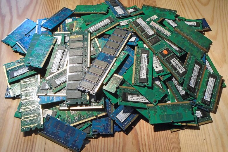 A pile of desktop and laptop RAM memory modules, illustrating rising memory costs in the PC market