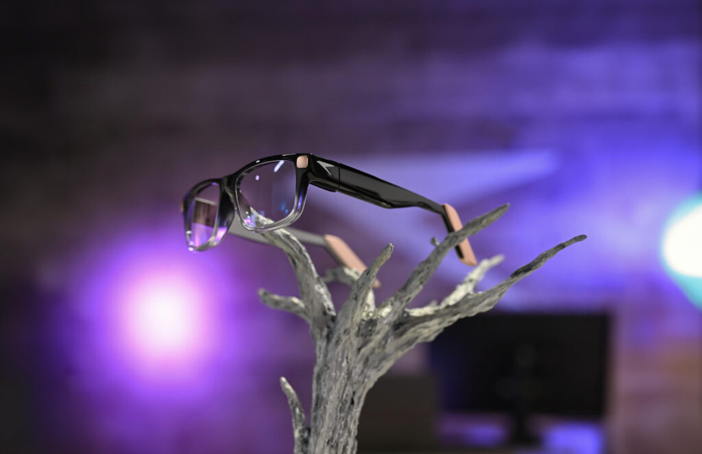 Raven Prism full-color Linux smart glasses displayed against purple lighting