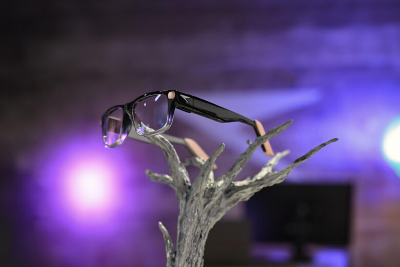 Raven Prism full-color Linux smart glasses displayed against purple lighting