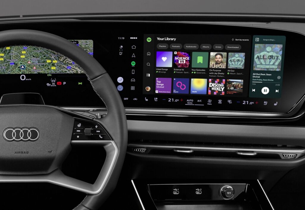 Spotify native in-car app displayed across an Audi MMI dashboard