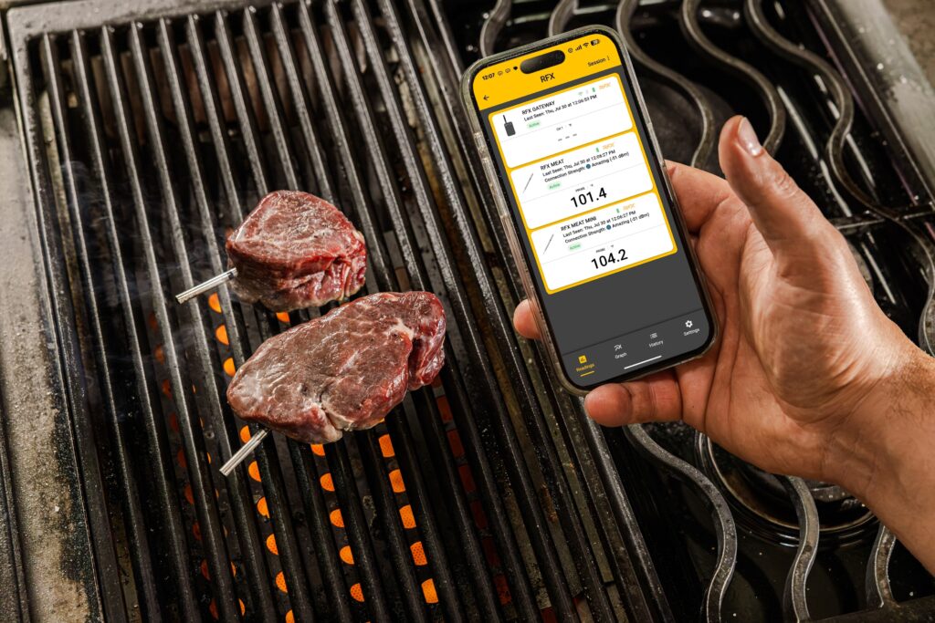 ThermoWorks RFX Meat Mini probes monitoring filet steaks on a grill through the ThermoWorks app